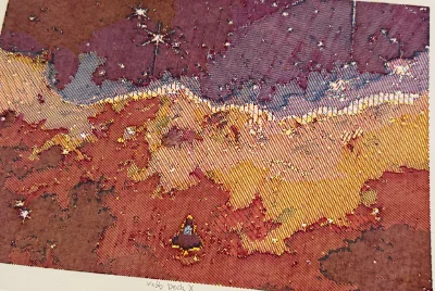 a nebula plotted in bands of purple, gold and red with bright stars